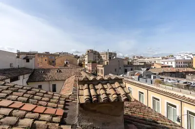 a bedroom with a bed and a brick wall at [15 min from Piazza Venezia] Skyline Sanctuary in Trastevere in Rome