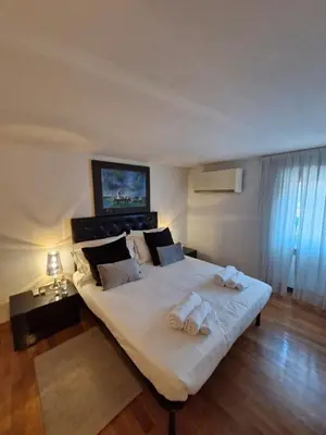 a bedroom with a large bed with towels on it at Apartment luxury Archimede 80 in Rome