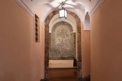 a hallway with an archway with a wall at Panoramic Apartment Trastevere in Rome