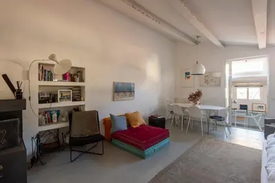 a living room with a couch and a table at Panoramic Apartment Trastevere in Rome