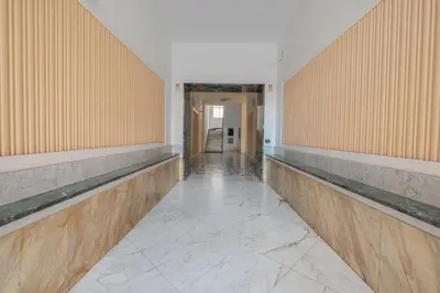 an empty hallway with wooden walls and marble floors at Basilica San Giovanni 1Bedr 5 minut from Station in Rome