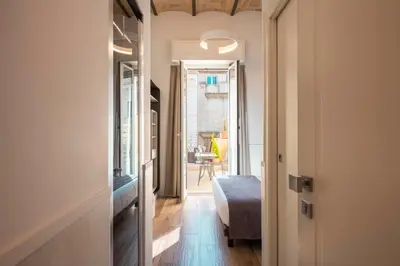 a hallway with a door leading to a room at Hotel de' Clementi in Rome