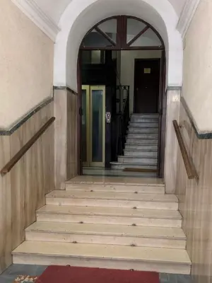 an entrance to a building with stairs and a door at Vatican Apartment near Metro Ottaviano in Rome