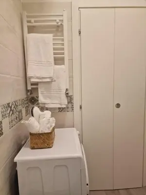 a bathroom with a toilet with a basket on top of it at Casina Valtellina in Rome