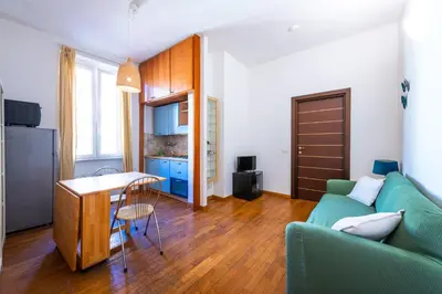a living room with a couch and a table at Casa Nica in Rome