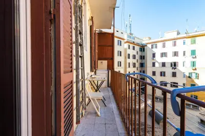 a balcony with a bench on the side of a building at Casa Nica in Rome