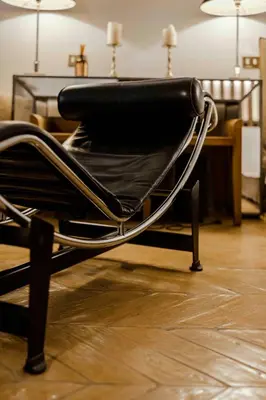 a black chair sitting in front of a table at Piazza Navona Luxury Loft in Rome