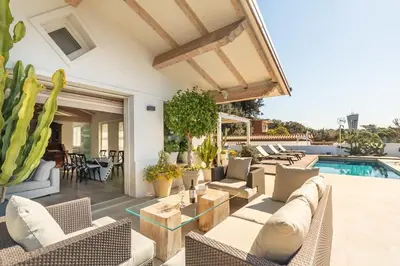 a villa with a swimming pool and a patio at Rome Design Villa in Rome