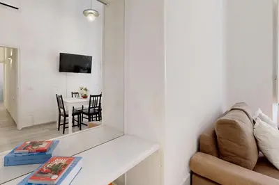 a living room with a couch and a table at Casa Vacanze BorgoVI House in Rome