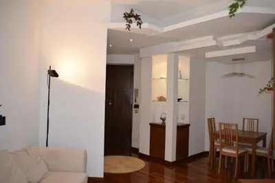 a living room with a couch and a table at Casa Vacanze Mazzini in Rome