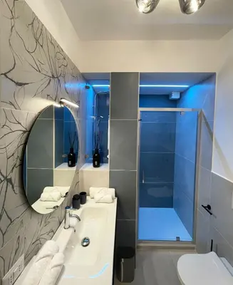 a bathroom with a sink and a shower at B&B Domus Teano Luxury Rooms in Rome