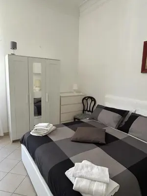 a bedroom with two beds with towels on them at Vatican Vittoria Suite in Rome