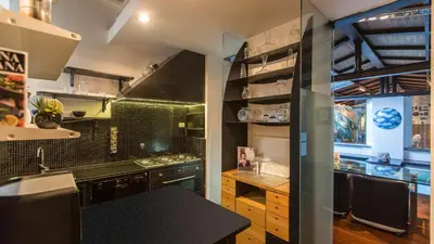 a kitchen with a sink and a counter top at Rental in Rome Riari Garden in Rome