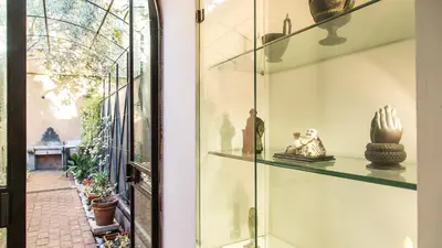a display case in a store with vases and statues at Rental in Rome Riari Garden in Rome