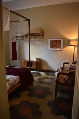 a room with a bedroom with a bed and a floor at BOUTIQUE TRASTEVERE in Rome