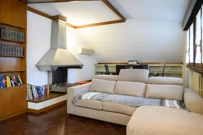 a living room with a couch and a fireplace at Casa Justa Anastasio in Rome