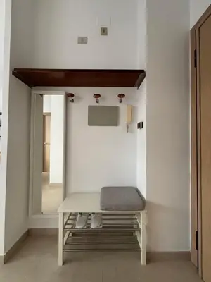 a dressing room with a bench and a mirror at Terrace Suite Roma San Giovanni in Rome