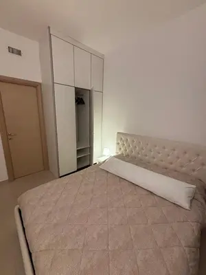 a bedroom with a large bed and a closet at Terrace Suite Roma San Giovanni in Rome