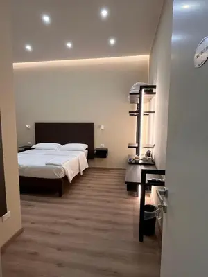 a hotel room with a bed and a hallway at Colosseum Deluxe in Rome