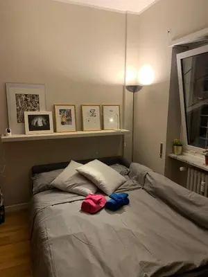 a bedroom with a bed with two towels on it at NINA'S HOUSE in Rome