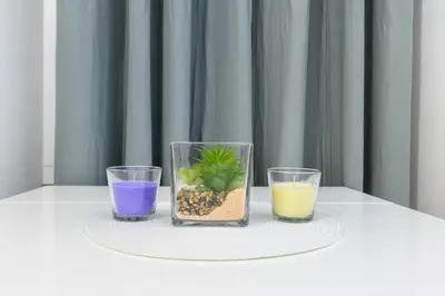 a table with three glasses and a plant in a vase at Appartamento via Visconti in Rome