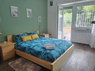 a bedroom with a bed with a laptop on it at Vatican Garden Oasi in Rome