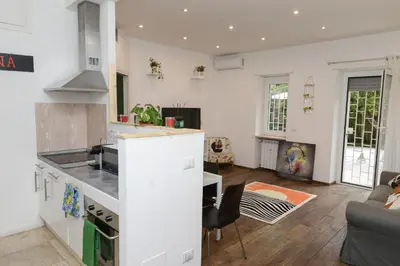 a kitchen and living room with a counter top at Vatican Garden Oasi in Rome