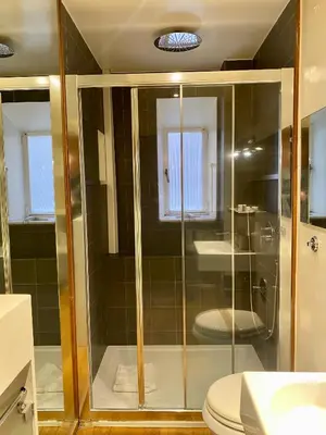 a glass shower in a bathroom with a toilet at 78 Luxury Margutta Suite in Rome