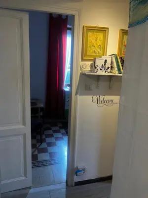 a hallway with a door open to a room at Ranieri casa vacanze in Rome