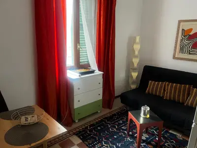 a living room with a couch and a window at Ranieri casa vacanze in Rome