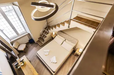 an overhead view of a room with a bed and a table at Videnda Colosseo in Rome