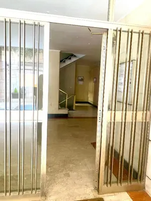 an empty room with metal bars on the door at ARCA LUXURY HOME in Rome
