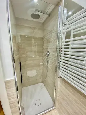 a shower with a glass door in a bathroom at ARCA LUXURY HOME in Rome