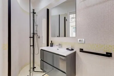 a bathroom with a sink and a shower at Aventino Industrial Loft in Rome