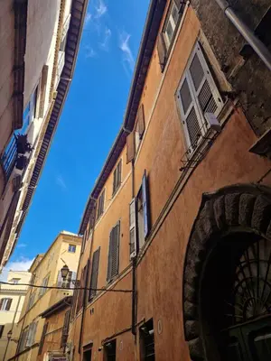 an alley between two buildings with a blue sky in the background at Home Bella Roma centro storico in Rome
