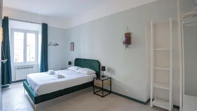 a white bedroom with a bed and a window at EasyTopStay - Crescenzio Stylish Apartment in Rome