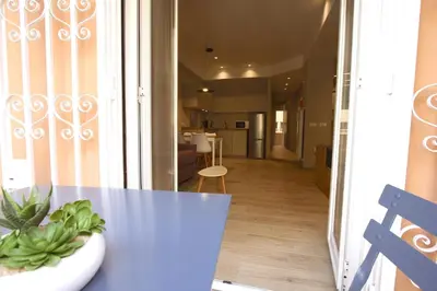 a table with a potted plant on it in a room at Aniene Holiday House in Rome