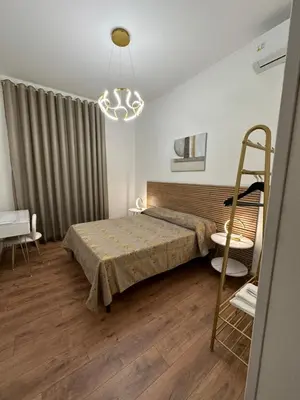 a bedroom with a bed and a ladder in it at luna in trastevere apartamento in Rome