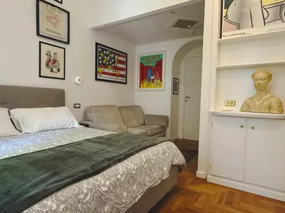 a greenhouse with plants and two chairs and a table at Vatican Modern Art apartment in Rome