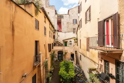 an alley in an old town with buildings at Campo de' Fiori Enchanting Attic in Rome