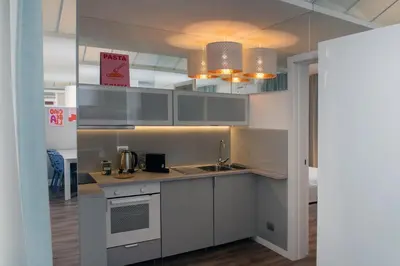 a kitchen with a sink and a counter top at COLOSSEUM VIEW ACCOMODATION in Rome