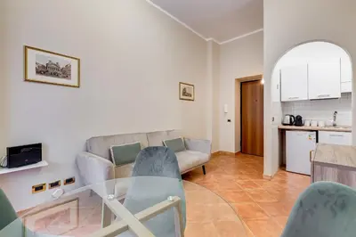 a living room with a glass table and a couch at URBANA 18 in Rome