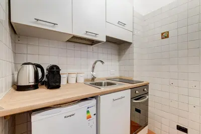 a small kitchen with a sink and a dishwasher at URBANA 18 in Rome