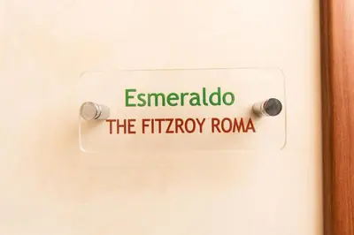 a sign on a door that reads emergency the roma at Allegria Fitzroy Cesar in Rome