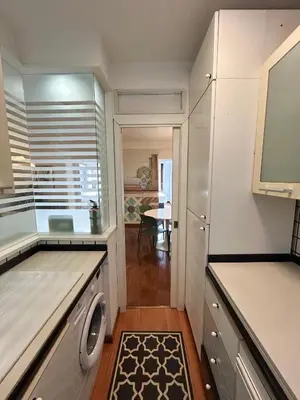 a kitchen with a washer and dryer at Serpenti 147 - Colosseum Apt in Rome