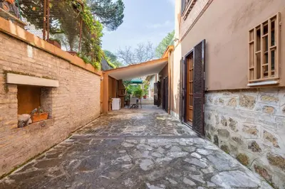 an alley way between two buildings at Maximo Luxe -Villa & Apartment in Rome