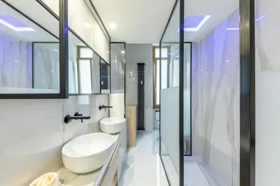 a bathroom with a sink and a toilet and a mirror at Blue Inn Luxury Suites in Rome