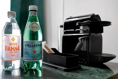 two bottles of beer are sitting on a counter at Via Veneto 116 Suites - Guest House in Rome