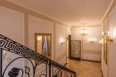 a hallway with a staircase and a mirror at Decimo Meridio- At Spanish Steps- in Rome