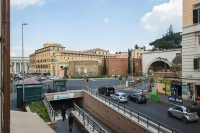 a busy city street with cars parked on the road at Holiday Home House Fornaci in Rome